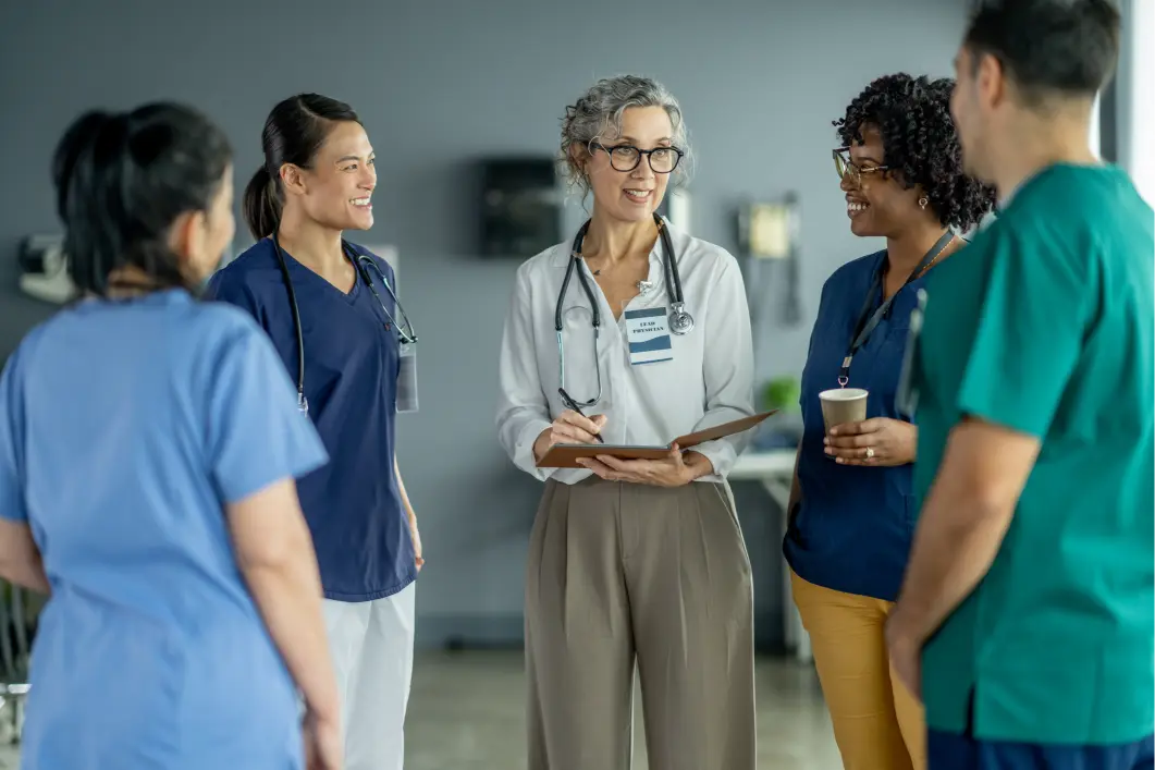 Healthcare professionals having a discussion in hospital.